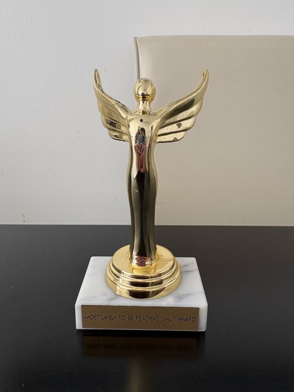 Gold Angel Trophy Sculpture most likely to be reading smut